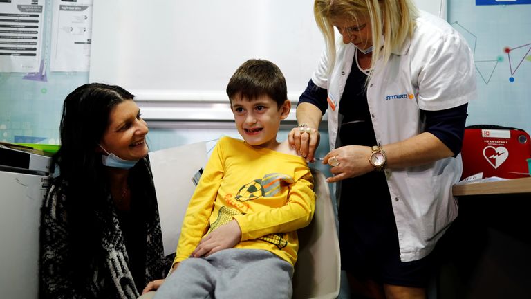 Nine-year-old Yoav pictured getting his first jab in Tel Aviv in November, after Israel approved vaccines for children aged 5-11 
