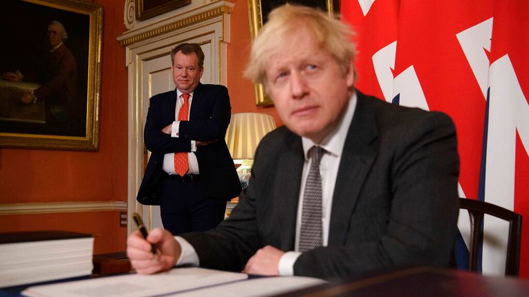Lord Frost and Boris Johnson signing the Brexit deal last year. Pic: AP