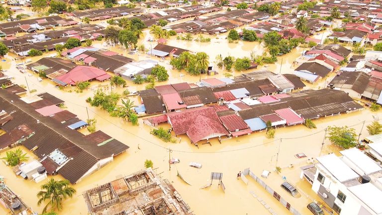An aerial view shows a flooded residential area after torrential rains, in this screen grab taken from a drone footage in Hulu Langat district, Selangor state, Malaysia December 19, 2021. SHAHRUL AZMIR via REUTERS THIS IMAGE HAS BEEN SUPPLIED BY A THIRD PARTY. MANDATORY CREDIT. NO RESALES. NO ARCHIVES.