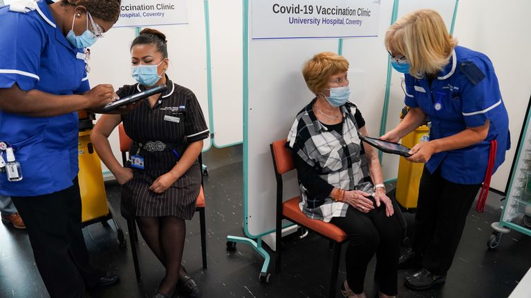 Margaret Keenan (second from right), received her booster jab in September, alongside May Parsons, the nurse who administered her first vaccine (second from left)