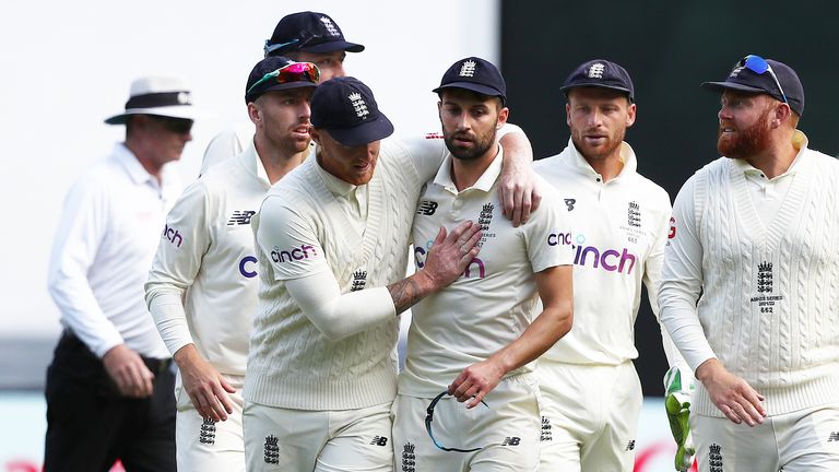 England&#39;s Mark Wood is congratulated by team mates after taking the final wicket of Scott Boland during day two of the third Ashes test at the Melbourne Cricket Ground, Melbourne. Picture date: Monday December 27, 2021.