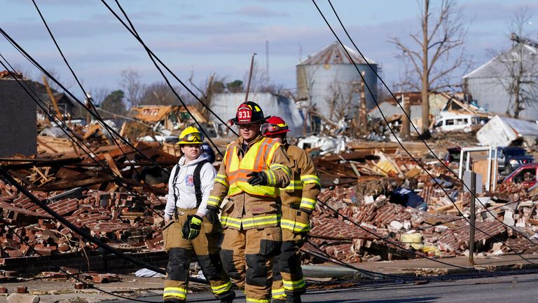 Emergency services survey the damage unleashed in Mayfield, Kentucky. 