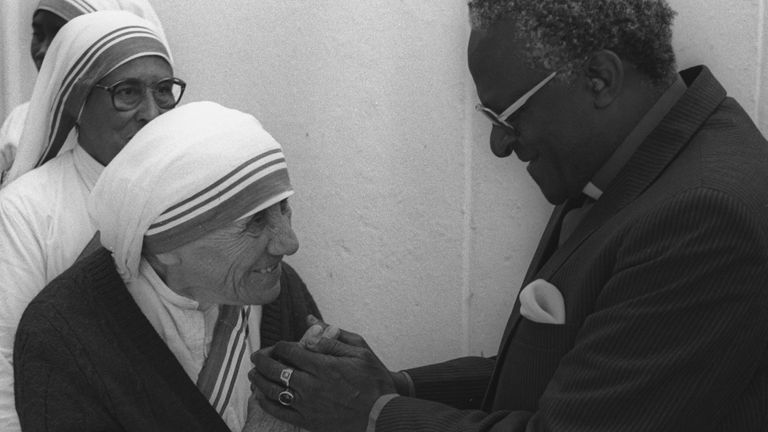 FILE PHOTO: Nobel Peace Price winners Mother Teresa of Calcutta and Archbishop Desmond Tutu meet prior to a lunch in Cape Town, South Africa on November 10, 1988. Mother Teresa is in Cape Town to open a House of Charity in a black township here. REUTERS/Ulli Michel/File Photo