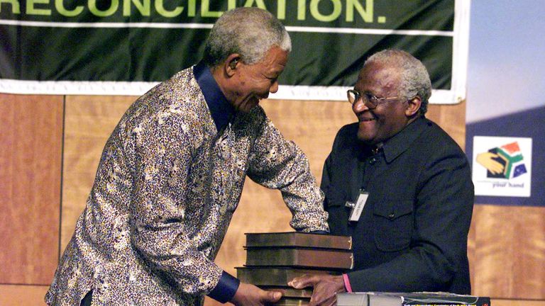 Chairman of the TRC (Truth and Reconciliation Commission) Archbishop Desmond Tutu (R) hands over the TRC report to South Africa&#39;s President Nelson Mandela at the State theater Building in Pretoria October 29. South Africa&#39;s Truth Commission has found that the ruling African National Congress (ANC) is politically and morally accountable for gross human rights violations committed during its 30-year struggle against apartheid.    
 