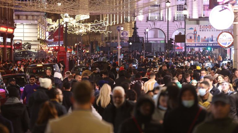 People gather in large numbers in Leicester Square to celebrate New Year&#39;s Eve