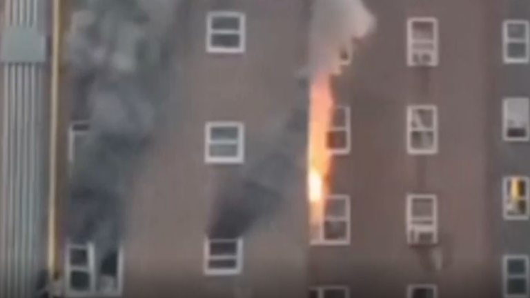 The thick smoke and flames appeared to erupt quickly from the block of flats
