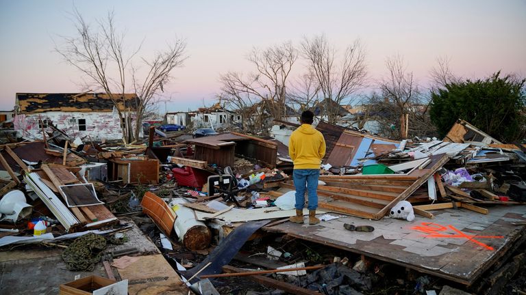 Nicolaus Kruse, 23, stands amongst the rubble of the home he grew up in after a devastating outbreak of tornadoes ripped through several U.S. states, in Mayfield, Kentucky, U.S. December 13, 2021. REUTERS/Cheney Orr