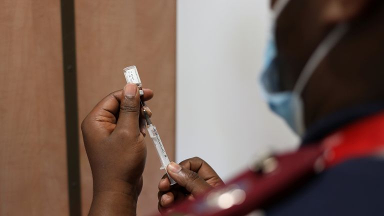A nurse prepares a dose of the COVID vaccine as the new Omicron variant spreads, in Dutywa, in the Eastern Cape province, South Africa