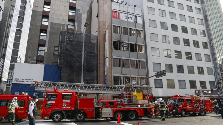 Fire trucks are seen in front of a building where a fire broke out in Osaka.