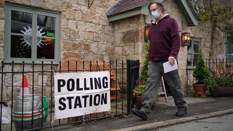A man leaves a polling station in the Docks public house on the outskirts of Oswestry, during voting for the North Shropshire by-election which was triggered by Owen Paterson&#39;s resignation. Picture date: Thursday December 16, 2021.