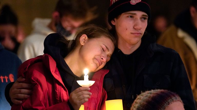 Mourners attend a vigil at LakePoint Community Church in Oxford, Mich, after three students are shot dead