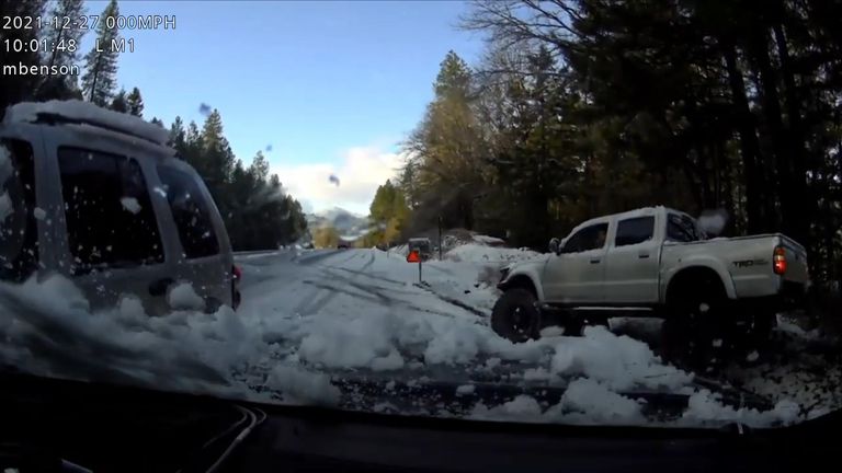 Police car in Oregon hit by sliding SUV on black ice