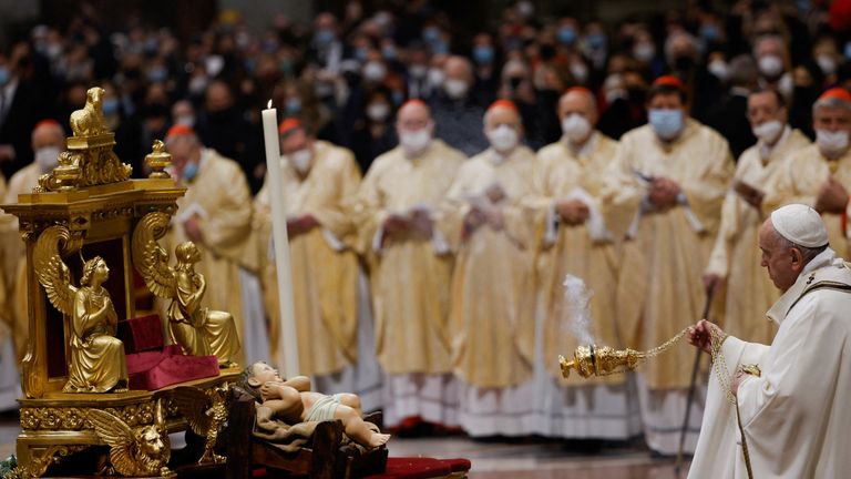 Pope Francis celebrates Christmas Eve Holy Mass in St. Peter&#39;s Basilica at the Vatican, December 24, 2021. REUTERS/Guglielmo Mangiapane