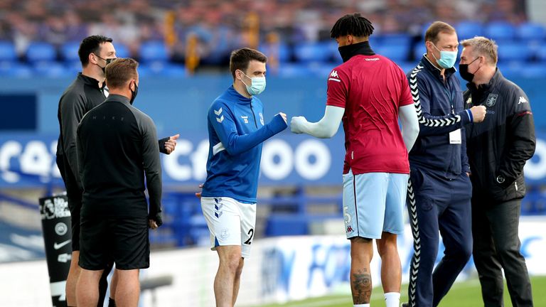 Everton&#39;s Seamus Coleman (left) bumps fists with Aston Villa&#39;s Tyrone Mings on the pitch ahead of the Premier League match at Goodison Park, Liverpool. Issue date: Saturday May 1, 2021.