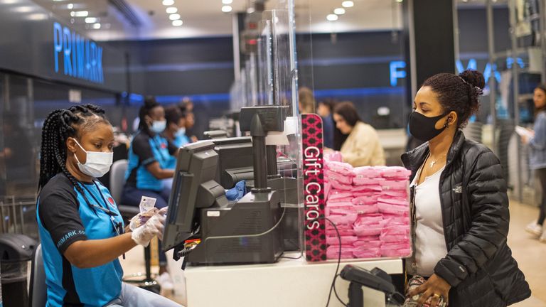 A staff member and customer at the till point, inside Primark in Oxford Street, London as a scheme enabling people to get cash from retailers&#39; tills without needing to make a purchase is to be rolled out to more than 2,000 shops before the end of the year. 1/12/21