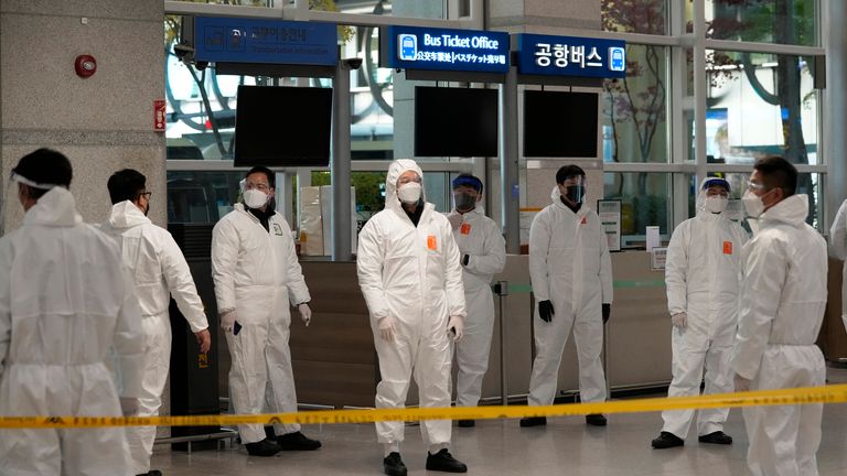 Quarantine officers wait to guide travelers at the arrival hall of the Incheon International Airport In Incheon, South Korea, Wednesday, Dec. 1, 2021. South Korea...s daily jump in coronavirus infections exceeded 5,000 for the first time since the start of the pandemic, as a delta-driven surge also pushed hospitalizations and deaths to record highs. (AP Photo/Ahn Young-joon)