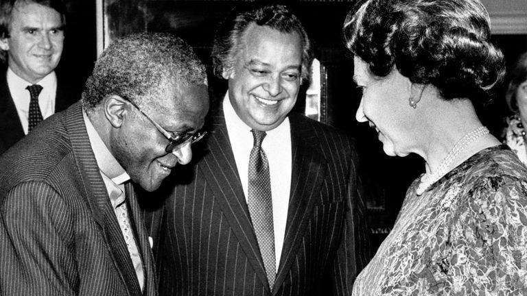 Queen Elizabeth II meets the Anglican Archbishop of Cape Town, Desmond Tutu at a Commonwealth Day Reception at Marlborough House, London, with Sir Shridath Ramphal, Secretary-General of the Commonwealth, looking on.
 09-Mar-1987