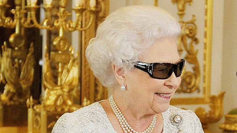 The Queen sports 3D glasses to preview her first Christmas message in three dimensions 