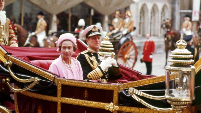 The Queen and Prince Philip ride through London on 7 June 1977. Pic: AP