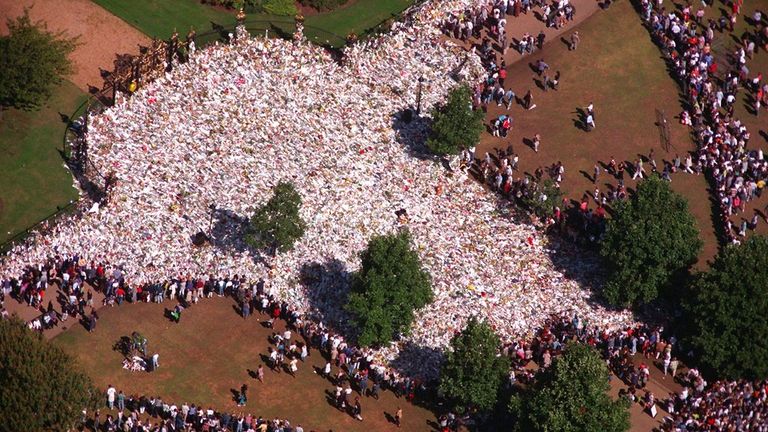 Flowers cover Kensington Palace Gardens after the death of Diana. Pic: AP