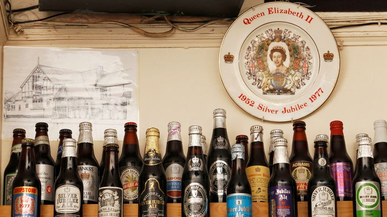 A commemorative plate and bottles of beer marking the Queen’s 25 years on the throne
