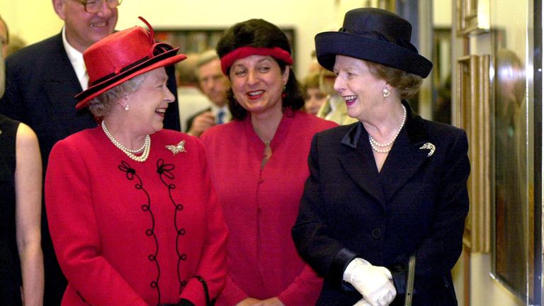 The Queen (L) with former Conservative Prime Minister Baroness Thatcher, while opening a new wing of the National Portrait Gallery in London. Between them is portrait painter Suzi Malin whose work is featured in the gallery.
