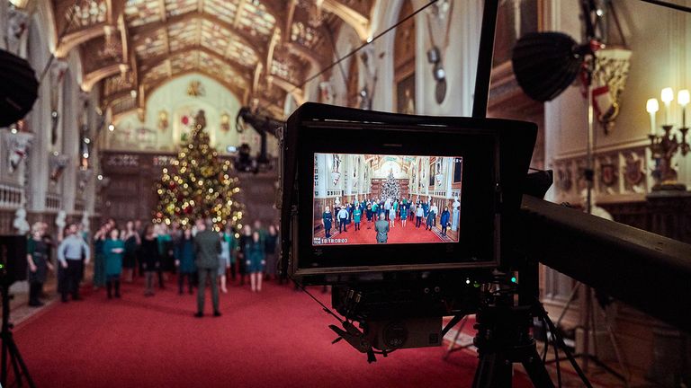 EMBARGOED TO 1600 GMT Friday December 24, 2021. For use only in connection with contemporaneous coverage of The Queen&#39;s 2021 Christmas broadcast. No further use without clearance from ITN. Handout picture of The Singology Community Choir recording a segment for The Queen&#39;s Christmas Broadcast inside St George&#39;s Hall in Windsor Castle.