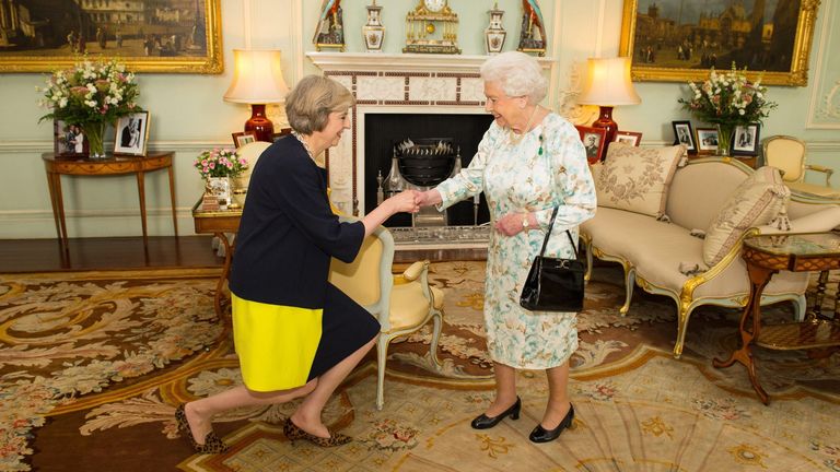 Queen Elizabeth II welcomes Theresa May at the start of an audience in Buckingham Palace, London, where she invited the former Home Secretary to become Prime Minister and form a new government.