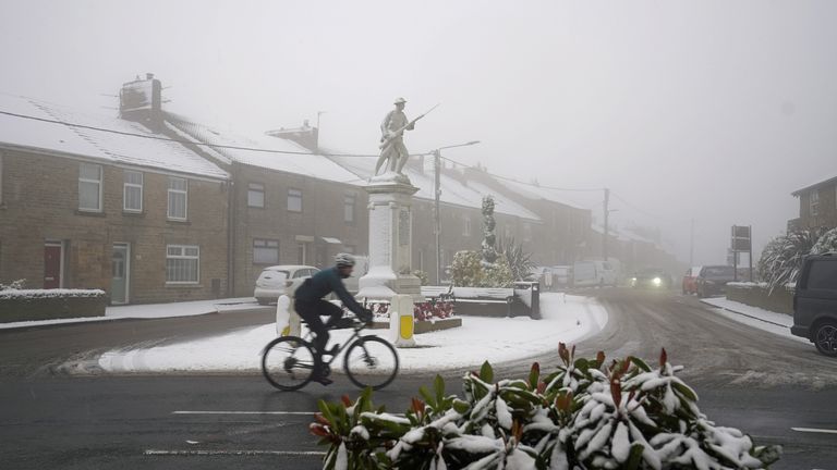 A cyclist rides through snowy conditions in Tow Law, County Durham. Parts of England from the East Midlands to the North-East have joined Scotland in preparing for blizzard-like conditions on Boxing Day as the white Christmas continues. Picture date: Sunday December 26, 2021.
