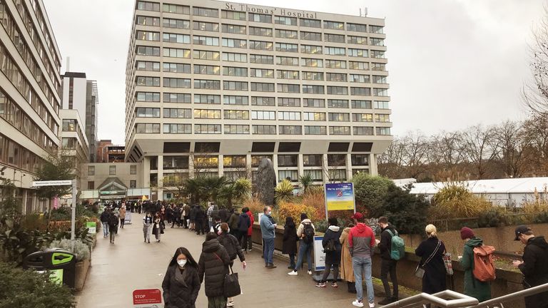 People queuing for booster jabs at St Thomas Hospital, London. Everyone over 18 in England will be offered booster jabs from this week, the PM said on Sunday night, as he declared an &#34;Omicron emergency&#34;. Picture date: Monday December 13, 2021.
