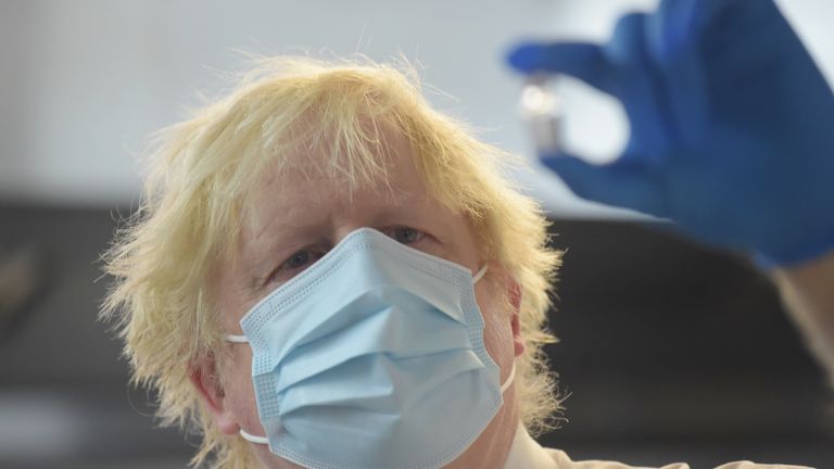 Prime Minister Boris Johnson during a visit to the Stow Health Vaccination centre in Westminster, central London. Picture date: Monday December 13, 2021.

