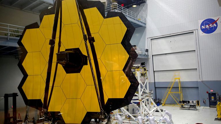 The telescope&#39;s mirror consists of 18 hexagonal segments of gold-coated beryllium metal