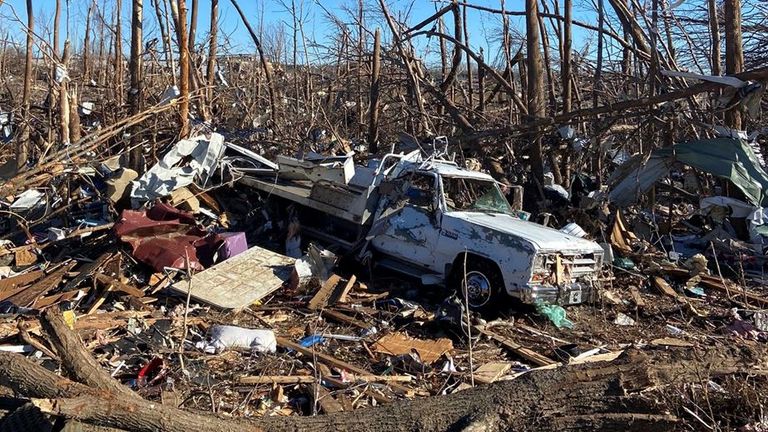 Trees have been stripped bare and trucks thrown around like toys