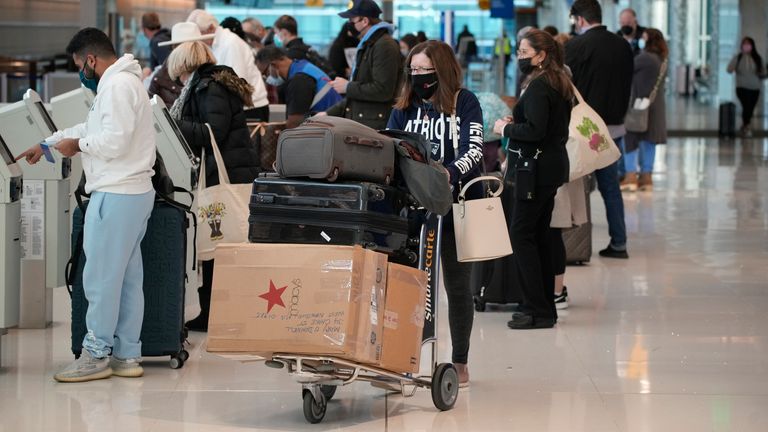 Travelers queue up in Denver International Airport on Boxing Day. Pic: Ap