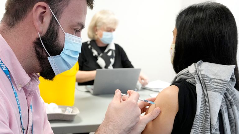 A vaccinator gives a Pfizer COVID-19 jab in London. Pic: AP