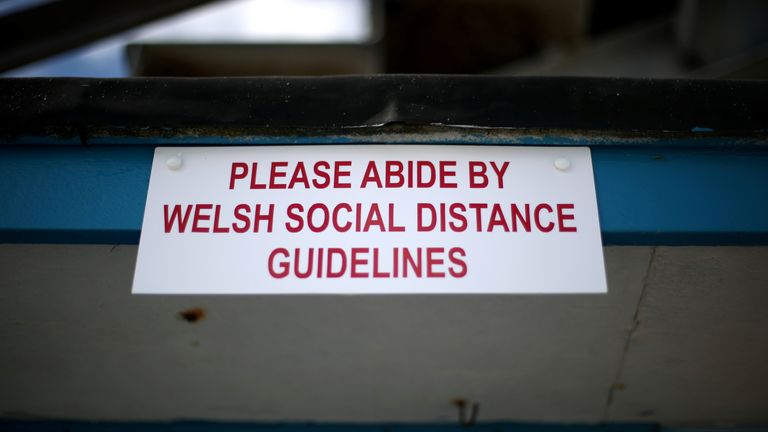 A sign is seen on the first weekend of Llandudno Pier being reopened as restrictions are eased following the coronavirus disease (COVID-19) outbreak in Llandudno, Wales, Britain July 11, 2020. REUTERS/Carl Recine
