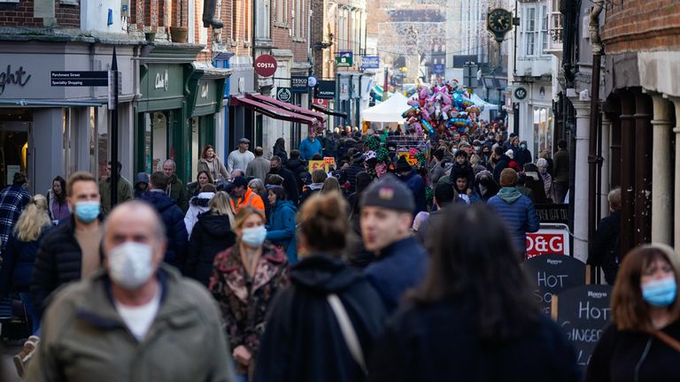 People do their Christmas shopping in Winchester, Hampshire on Tuesday