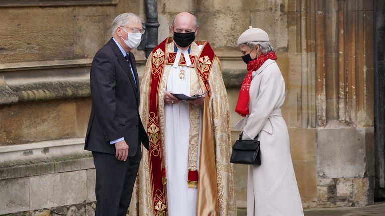 The Duke and Duchess of Gloucester are met by the Dean of Windsor (centre) as they arrive to attend the Christmas Day morning church service at St George&#39;s Chapel, Windsor Castle. Picture date: Saturday December 25, 2021.
