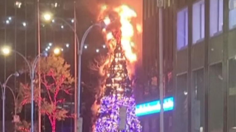 A man was charged with arson for setting fire to a 50ft (15m) Christmas tree in front of Fox News headquarters in Manhattan.