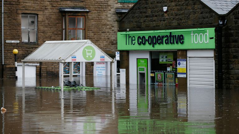 FILE PIC Flood water outside a co-operative supermarket in Hebden Bridge in West Yorkshire, where flood sirens were sounded after torrential downpours.
