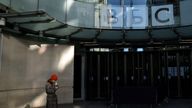 A person stands outside the BBC Broadcasting House offices and recording studios in London, Britain, January 17, 2022.REUTERS/Hannah McKay
