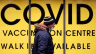 A man walks past the Soho Pharmacy, Handsworth, Birmingham, Britain, January 10, 2022. REUTERS/Carl Recine
