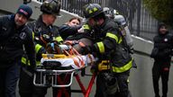 Emergency personnel from the FDNY provide medical aid as they respond to an apartment building fire in the Bronx borough of New York City, U.S., January 9, 2022. REUTERS/Lloyd Mitchell