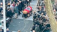 A picture made available by the Italian online news portal Open, showing people gathered around a swastika-covered casket outside the St. Lucia church, in Rome, Monday, Jan. 10, 2022. The Catholic Church in Rome on Tuesday, Jan. 11, 2022, strongly condemned as "offensive and unacceptable" a funeral procession outside a church in which the casket was draped in a Nazi flag and mourners gave the fascist salute. (Open Via AP)
PIC:Open Via AP

