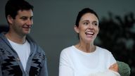 New Zealand Prime Minister Jacinda Ardern carries her newborn baby Neve Te Aroha Ardern Gayford with her partner Clarke Gayfor as she walks out of the Auckland Hospital in New Zealand, June 24, 2018. REUTERS/Ross Land