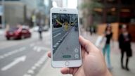 A "Pidgey" Pokemon is seen on the screen of the Pokemon Go mobile app, Nintendo&#39;s new scavenger hunt game which utilizes geo-positioning, in a photo illustration taken in downtown Toronto, Ontario, Canada July 11, 2016. REUTERS/Chris Helgren/File Photo
