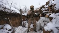 A Ukrainian serviceman cleans his position in a trench on the front line in the Luhansk region, eastern Ukraine, Friday, Jan. 28, 2022. High-stakes diplomacy continued on Friday in a bid to avert a war in Eastern Europe. The urgent efforts come as 100,000 Russian troops are massed near Ukraine&#39;s border and the Biden administration worries that Russian President Vladimir Putin will mount some sort of invasion within weeks. (AP Photo/Vadim Ghirda)