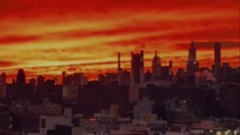 Videos of a bright orange and pink sunset flooded social media as New Yorkers filmed the marvel from building roofs.