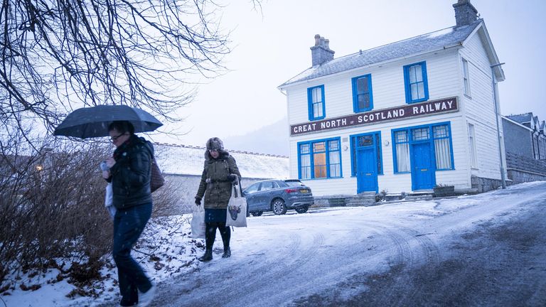 Members of the public walk through the snow in Braemar, Aberdeenshire. Picture date: Thursday January 6, 2022.