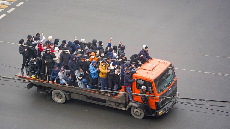 Demonstrators rode a truck in protests in Almaty on Wednesday
